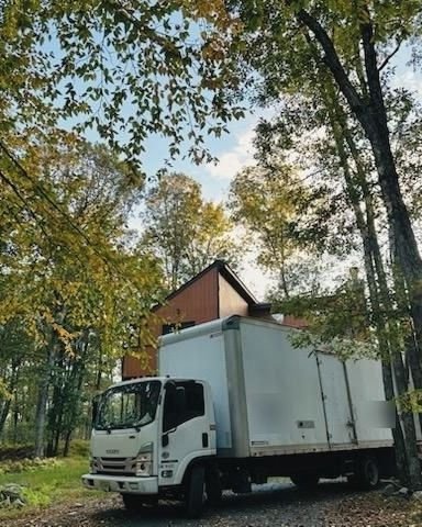 Our truck at a house in the woods in the fall