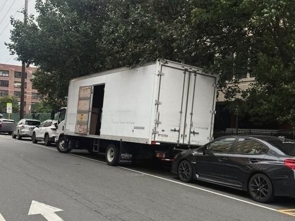 Our truck loading on a city street, back door open